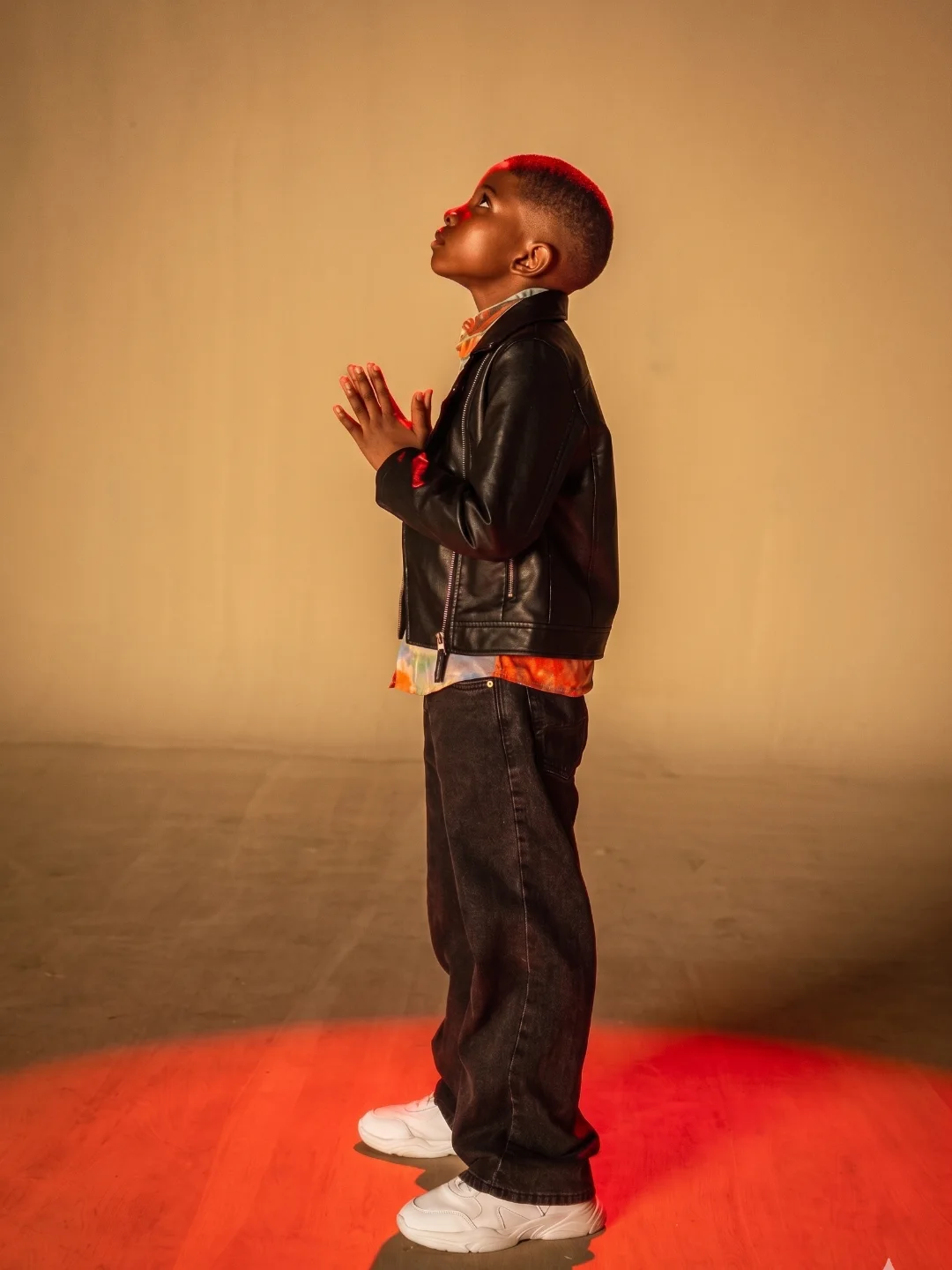 Xade sitting under red light